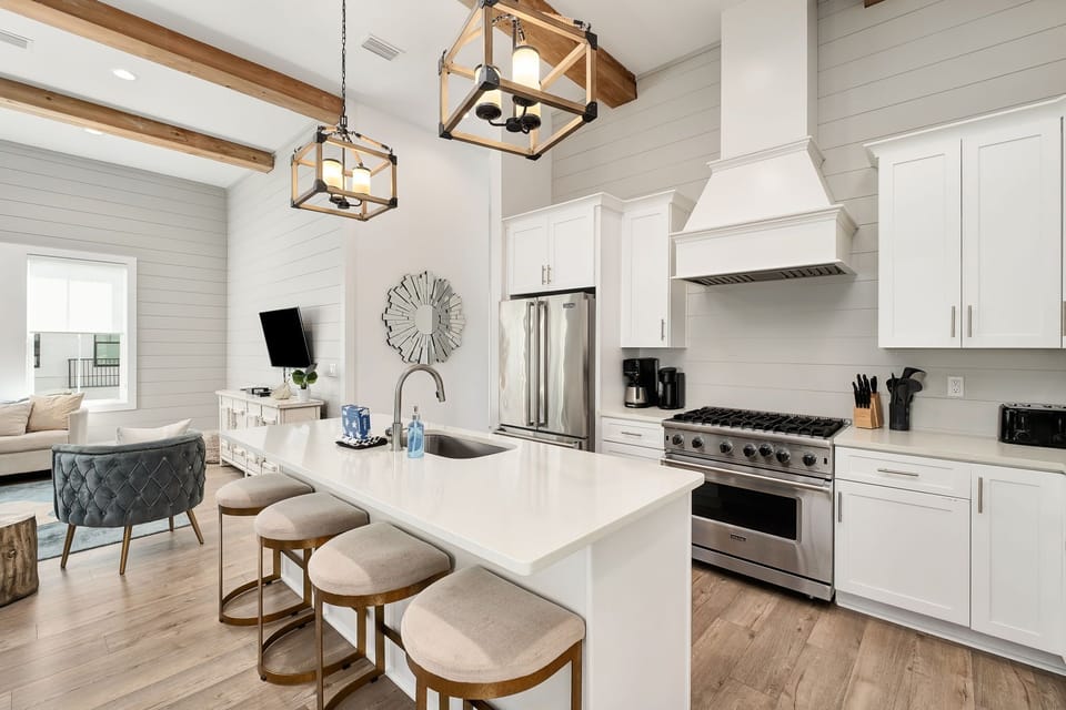 Thoughtfully designed kitchen with premium, high-end appliances and clean, coastal-inspired finishes.