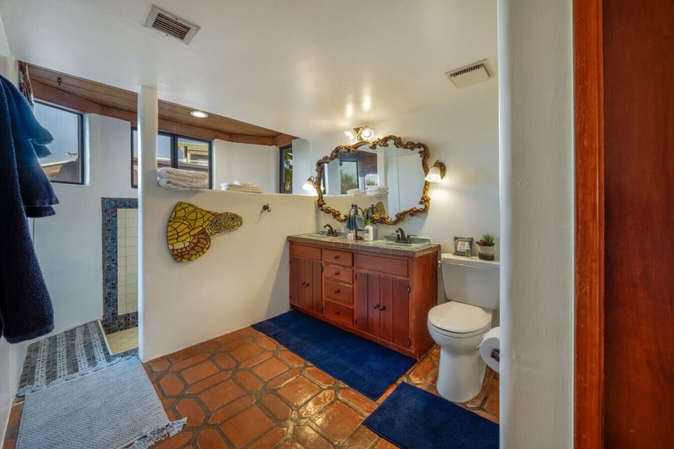 Bathroom 1 with sunken tub/shower combo and lots of beautiful natural light