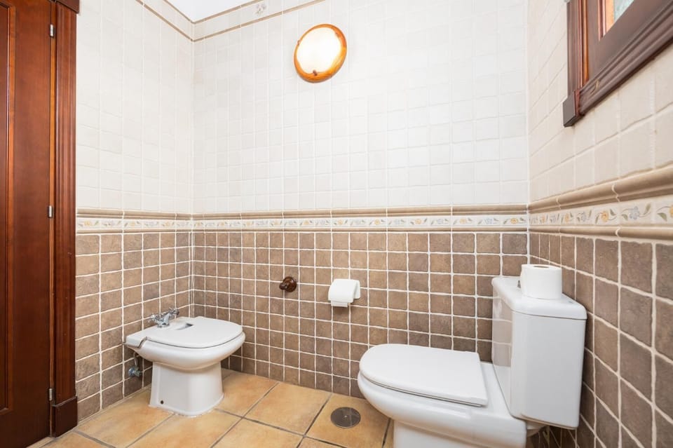 Family bathroom with bath and shower