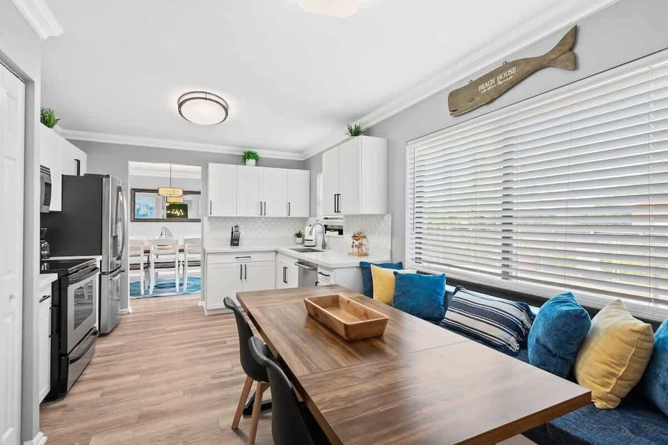 Charming built in bench making breakfast nook cozy and comfortable. 