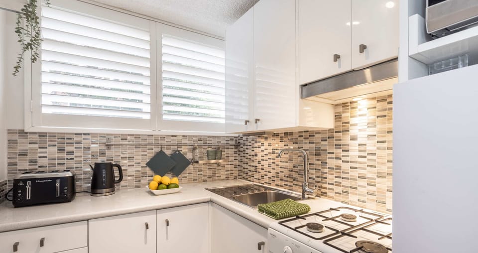 Spacious kitchen with four burner gas cooktop