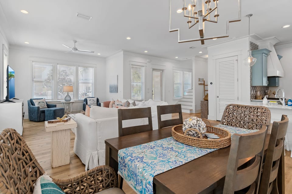 Open dining area that flows seamlessly into the living room, creating a spacious and inviting environment for family meals and gatherings