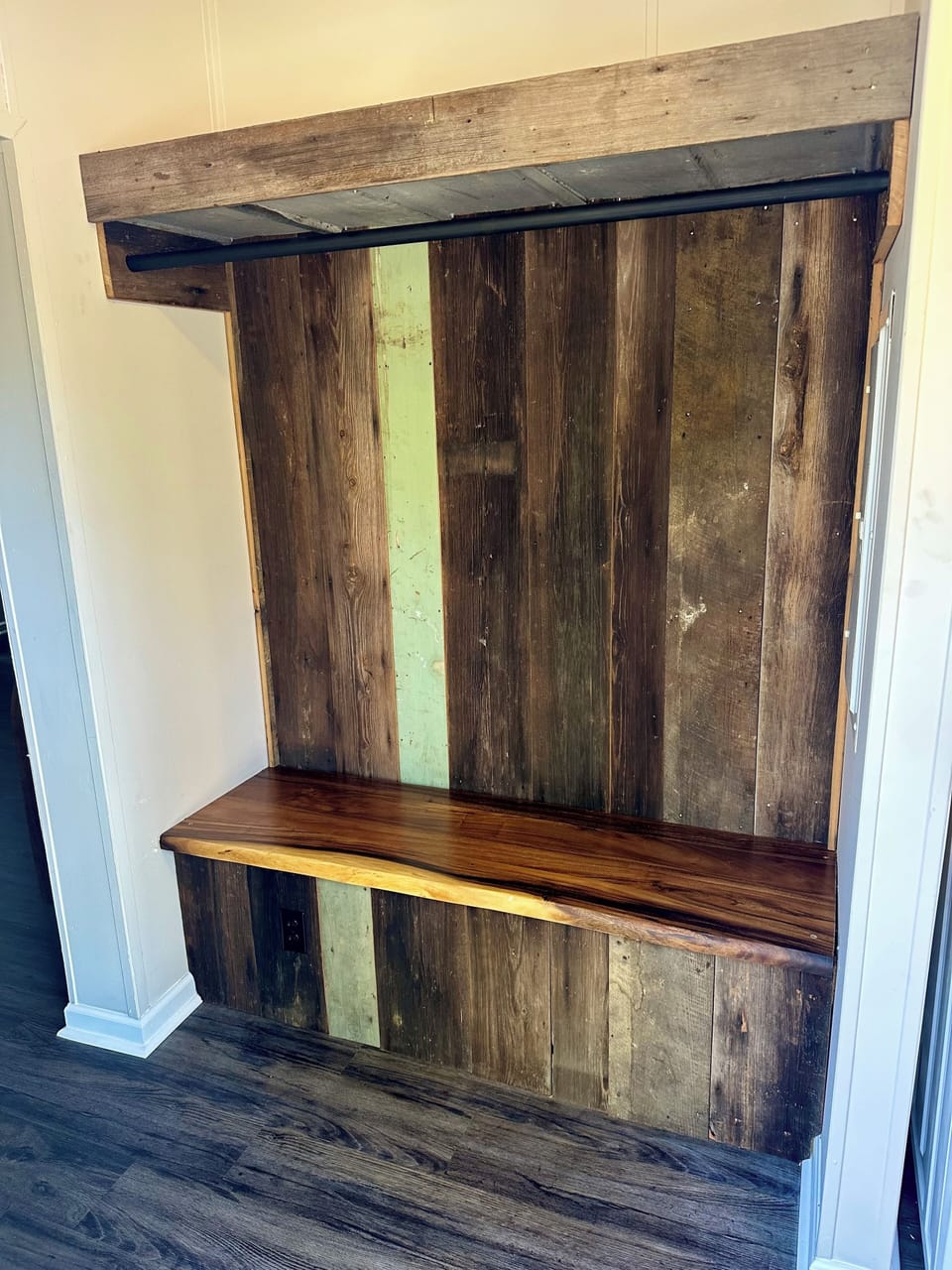 Mud Room with rod for hanging clothes.