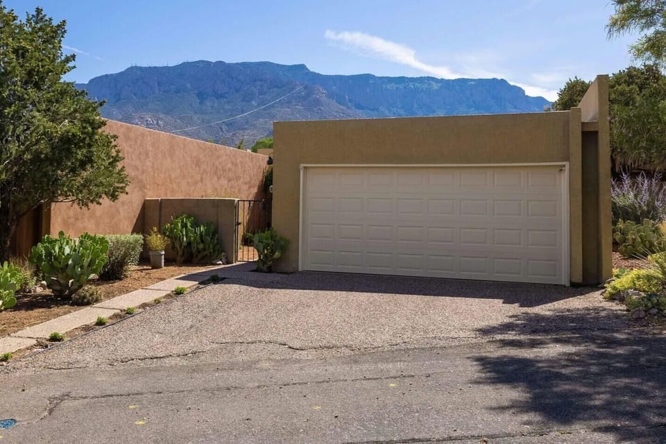 2 car garage fits medium cars only but parking diagonally on the drive works. 