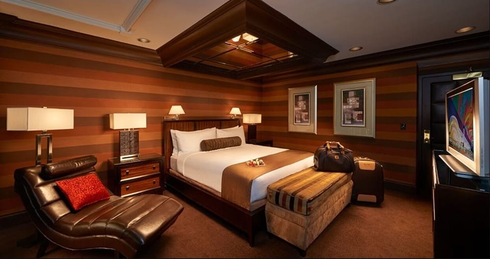 Sink into warm lighting and lounge beside your king bed.