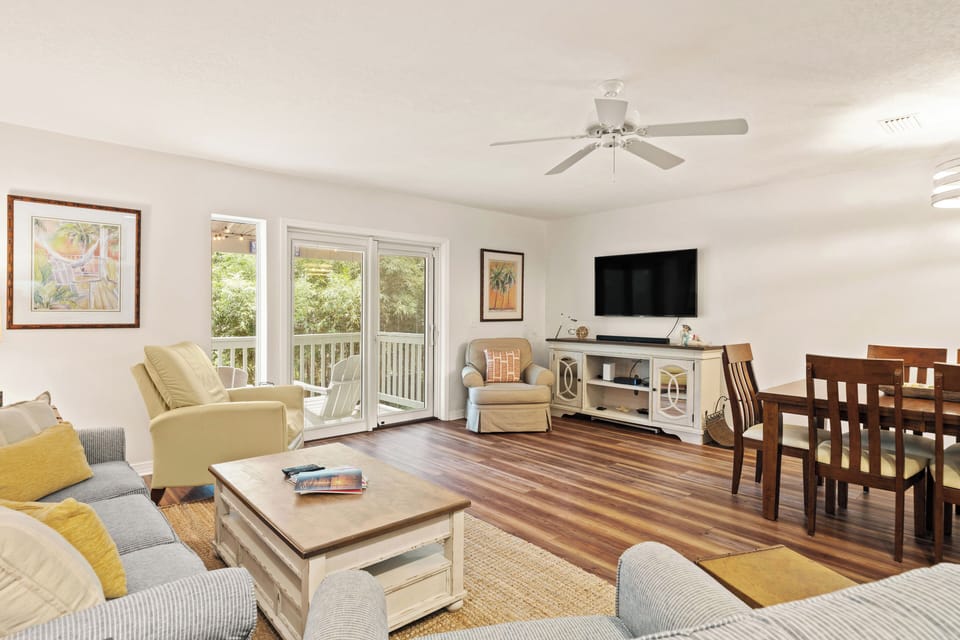 Living room feature a smart TV and access to the covered balcony