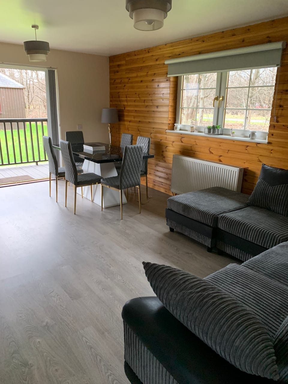 living/dining area with patio doors opening to garden and hot tub area
