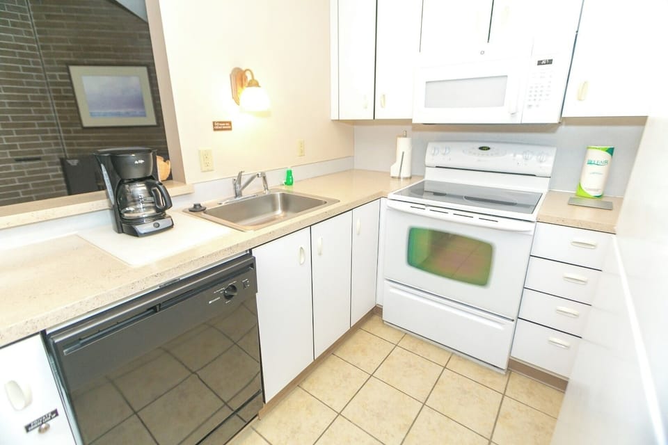 Brew fresh coffee and prep snacks on spacious counters.