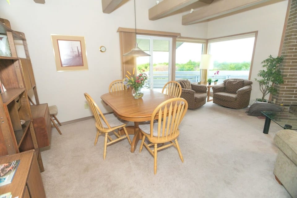 Share meals together at the inviting dining table for four.