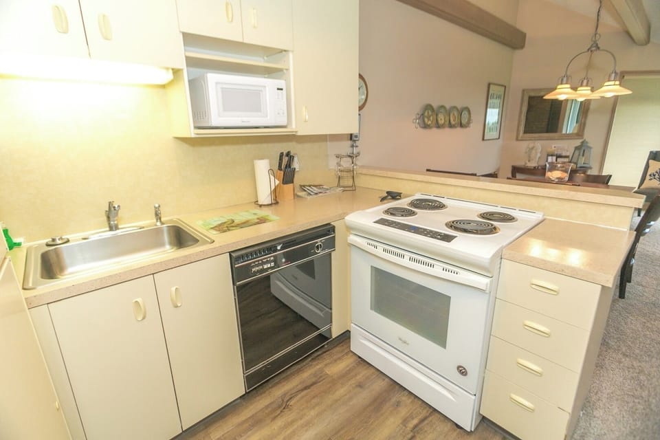 Prep and serve comfortably with a bright, practical kitchen layout.
