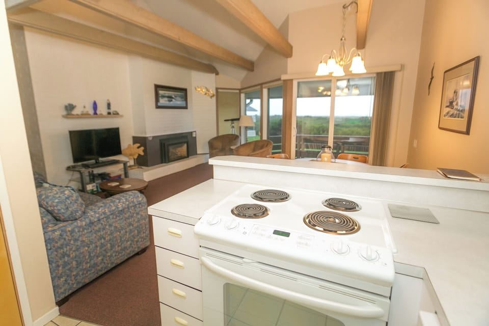 Sip coffee while cooking with an airy, open layout.