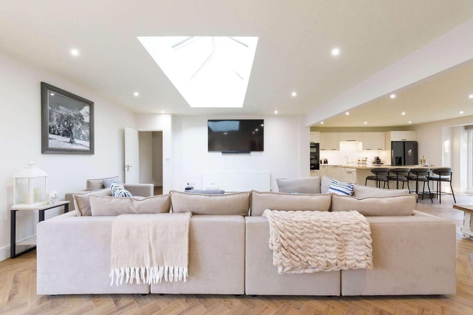 Relax on the huge, plush corner sofa after a day exploring the area.