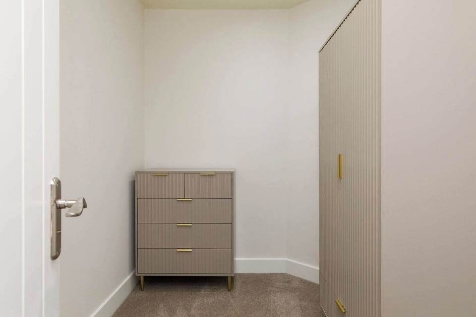 A separate dressing room leads off the master bedroom.