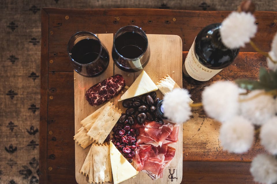 Charcuterie and wine setup for a cozy, memorable cabin experience.
