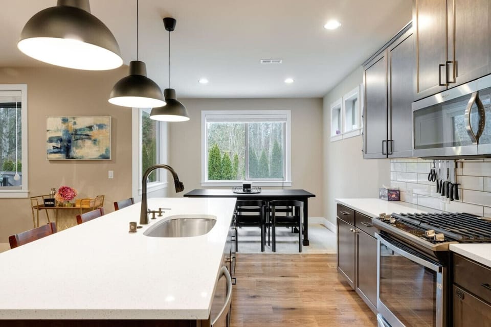 Enjoy a quick snack at the kitchen island with seating for four, perfect for casual bites or family chats.