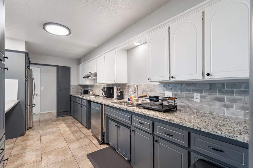 Cook in a sleek kitchen designed for both function and beauty.