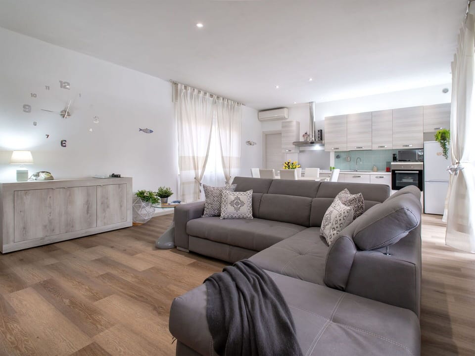 Furniture, Interior Design, Flooring, Couch, Floor, Wood, Living Room, Wood Flooring, Room, Apartment