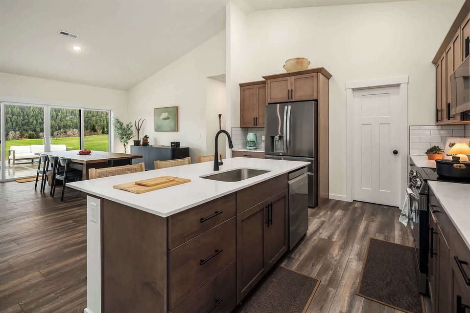 Step into a beautifully designed kitchen that blends modern convenience with a warm, inviting atmosphere. The sleek quartz countertops, stylish cabinetry, and high-end stainless steel appliances make it a chef’s dream.