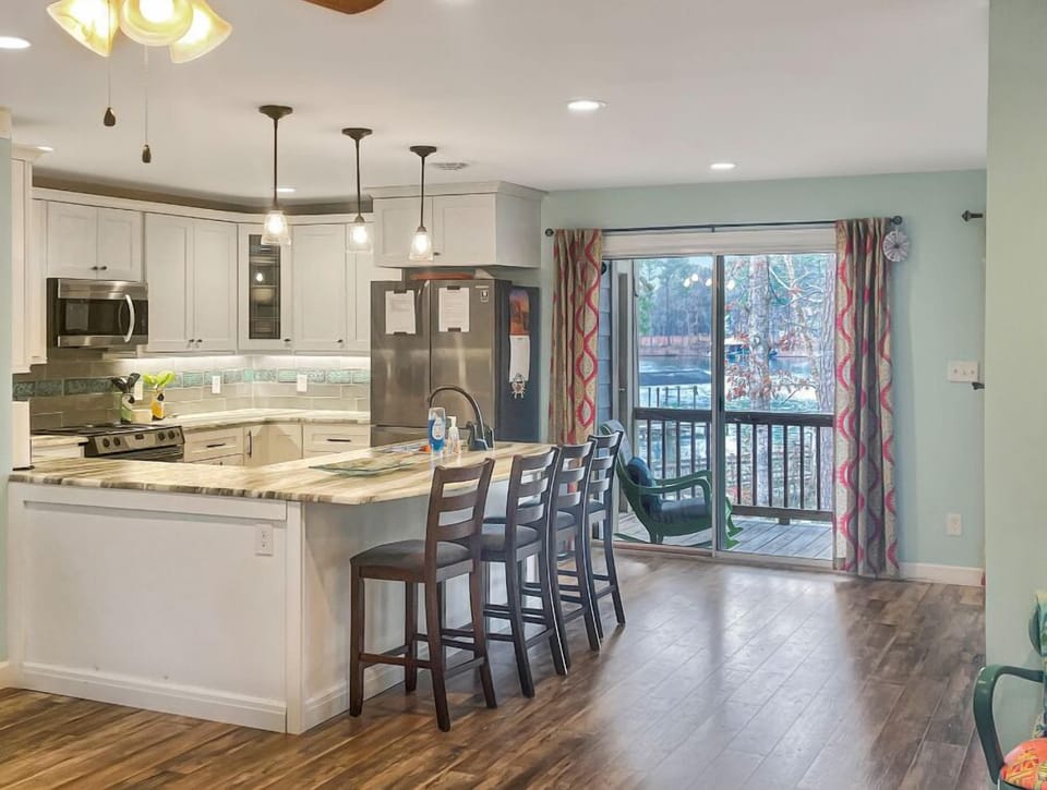 Kitchen:  Modern space with sleek appliances and natural light. 