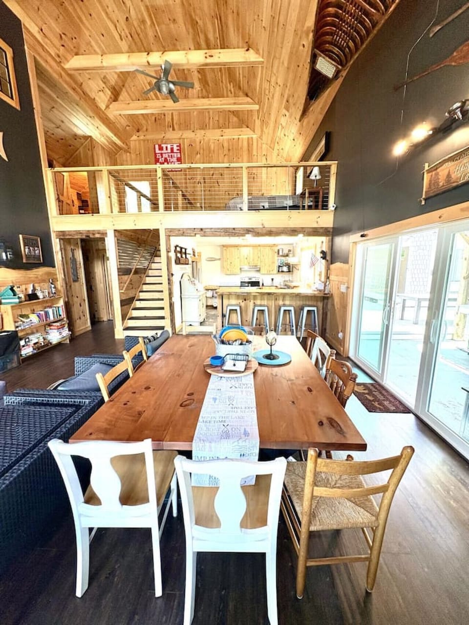 Rustic dining table with easy access to the kitchen and deck.