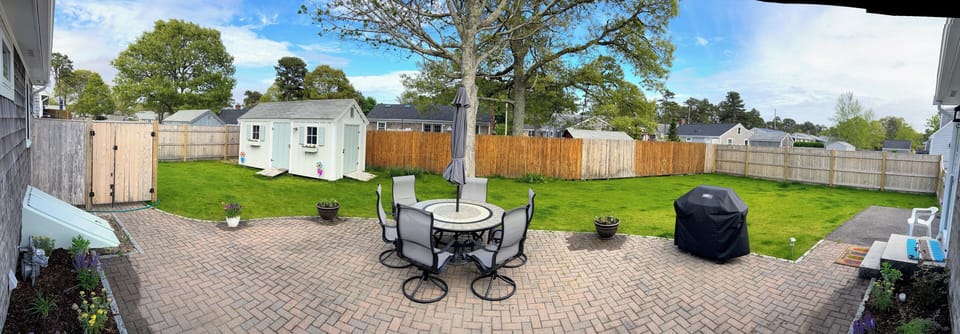 Expansive, fully fenced in backyard with extended outdoor shower!