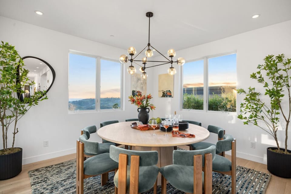 Gather in elegance and comfort in the dining room adjacent to the chefs kitchen