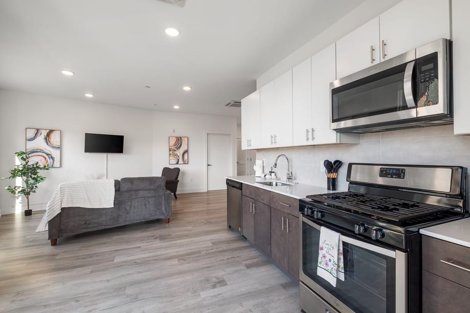 Kitchen and living area with open concept layout maximizing space.