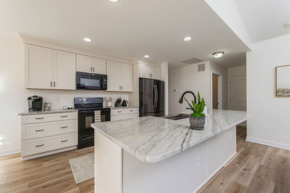 Prepare meals with ease on the elegant marble island.