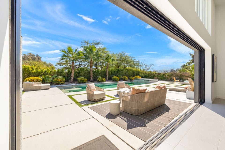 Open terrace w/ cushioned seating & wide views, ideal for relaxing in the sun