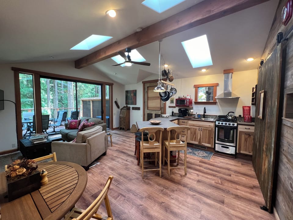 Kitchen and living room.  Skylights provide natural lighting