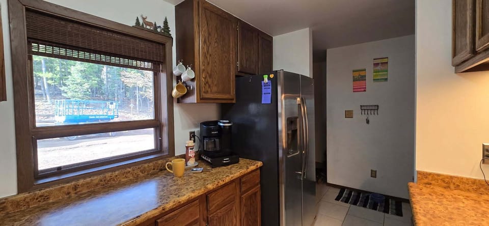 Spacious Galley Kitchen, fully stocked with cookware and child dinnerware. 