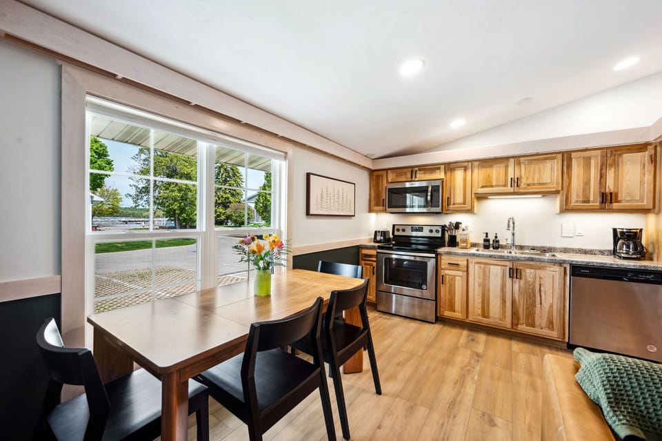 Full kitchen equipped with fridge, oven, microwave, and dishwasher.