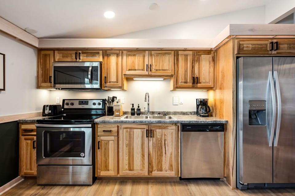 Kitchen comes with a coffeemaker, toaster, and all essential kitchen utensils.