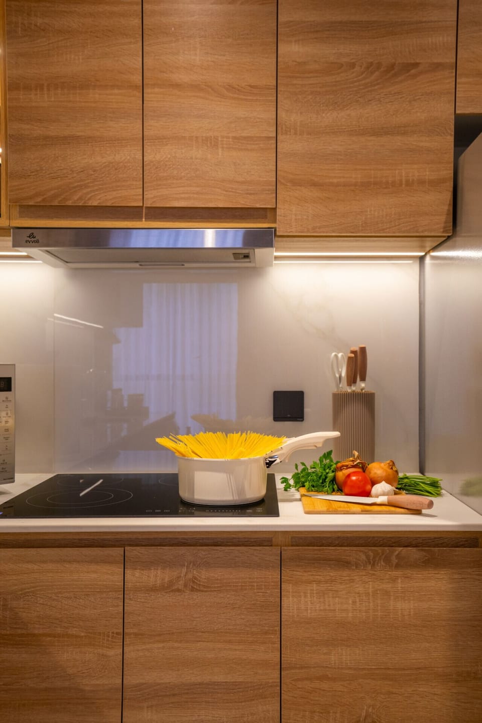 Warm wood tones and ambient lighting create a cozy feel.