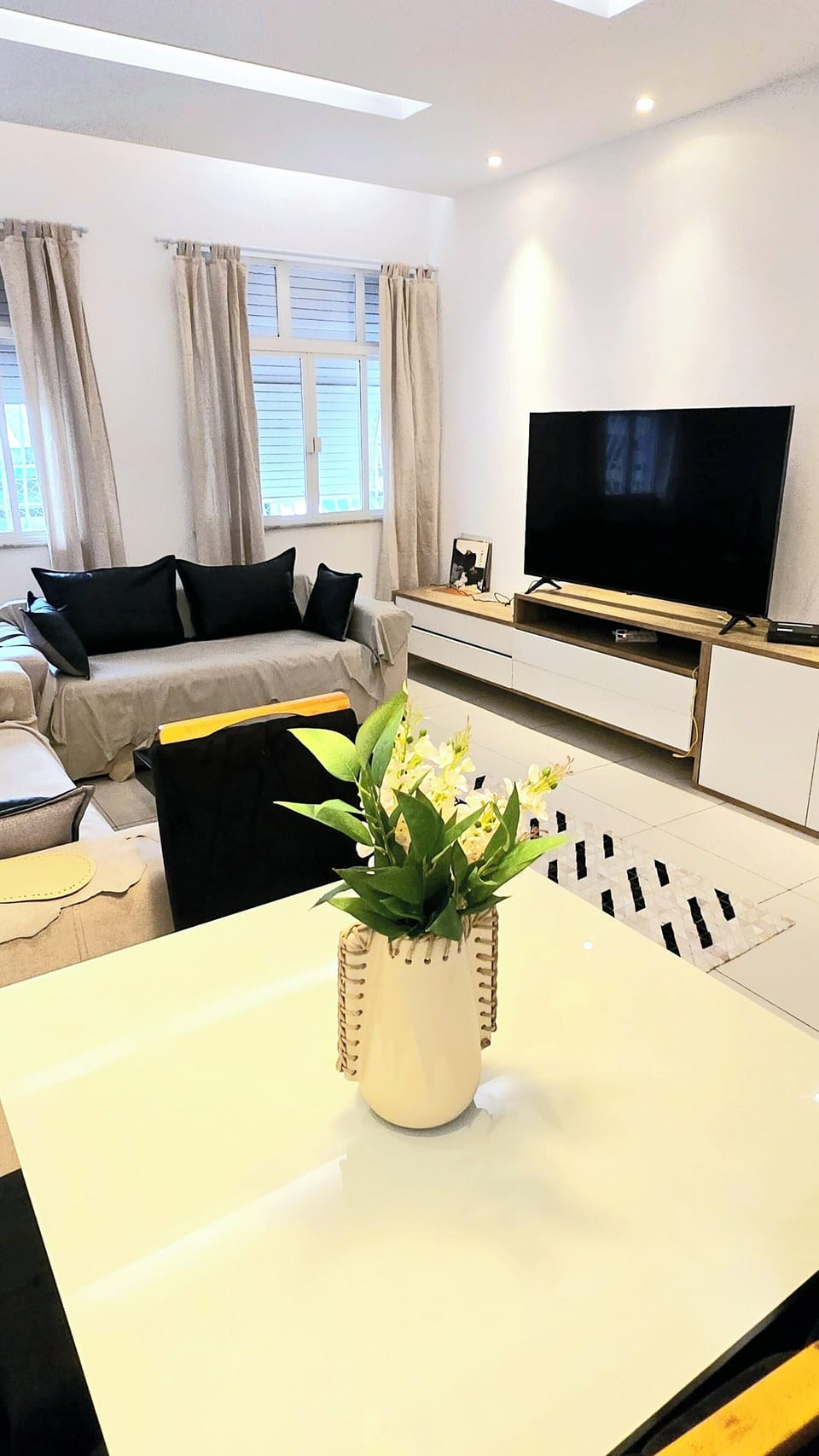 Living Room Dinning Room With Large Screen TV.