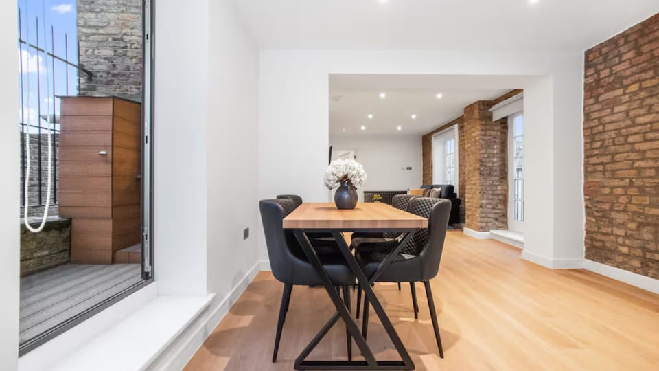 Light-filled area with rectangular dining set for four