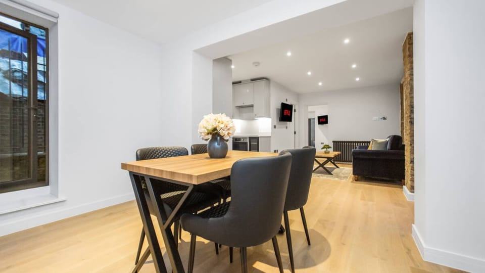 Elegant dining area with four seats and a rectangular table with charming décor.