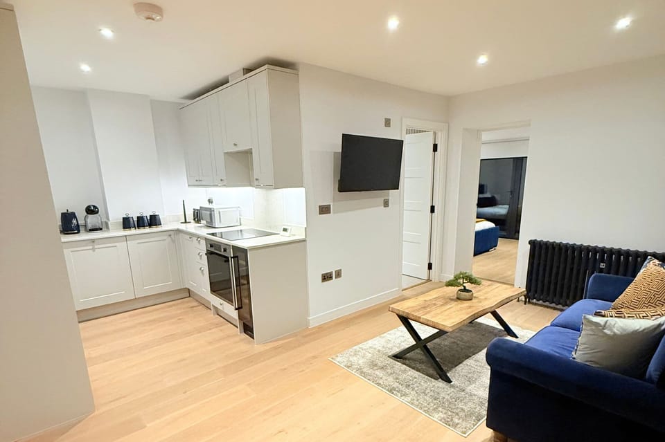 Inviting lounge with sofa bed, TV, Netflix, and a chic table for relaxing stays.