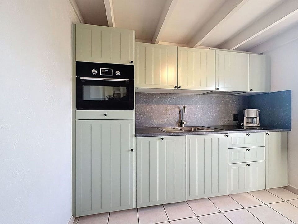 Wood, Cabinetry, Flooring, Kitchen, Major Appliance, Kitchen Appliance, Interior Design, Countertop, Floor, Cupboard