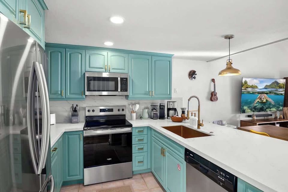 Fully Stocked  Kitchen: A dream kitchen with modern appliances, large bar, and a dedicated coffee station for your morning brew