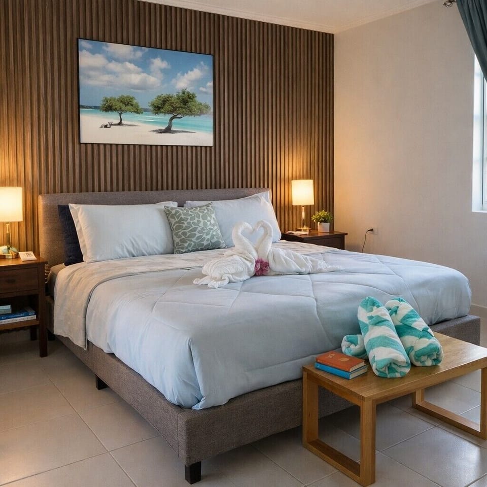 Peaceful queen bedroom overlooking the private hot tub courtyard