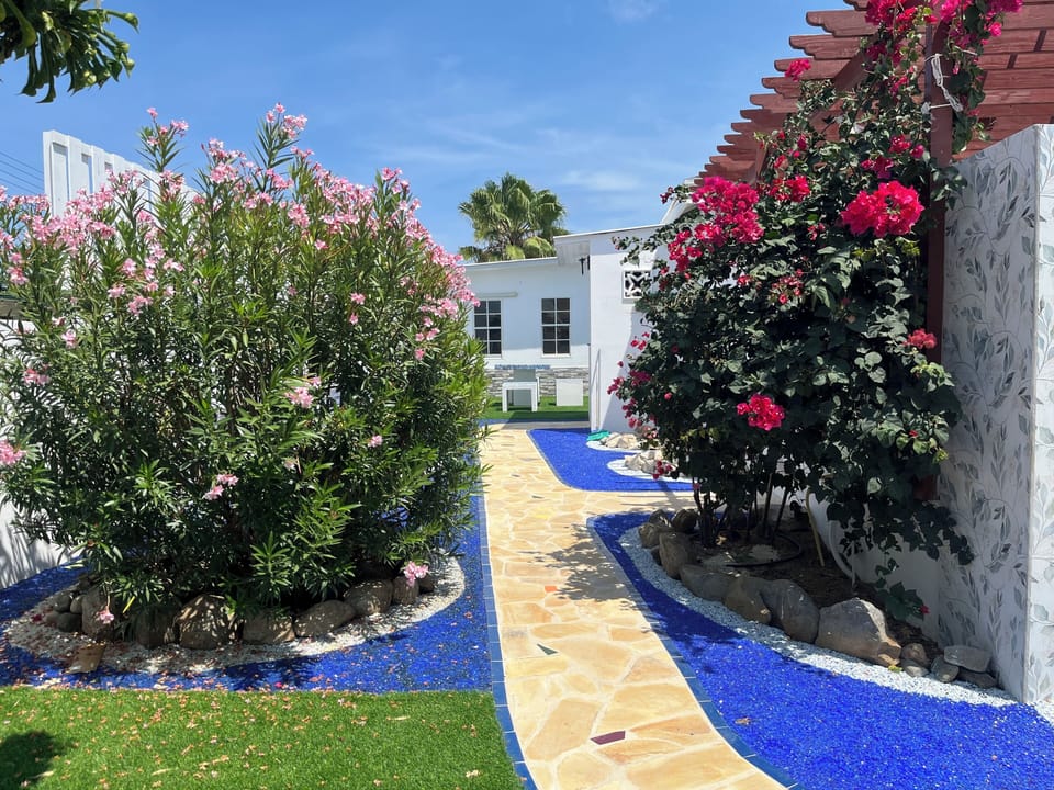 Walk through the tropical garden to your private garden