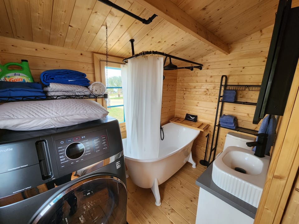 Full bathroom with soaking tub/shower attachment plus an outdoor shower!