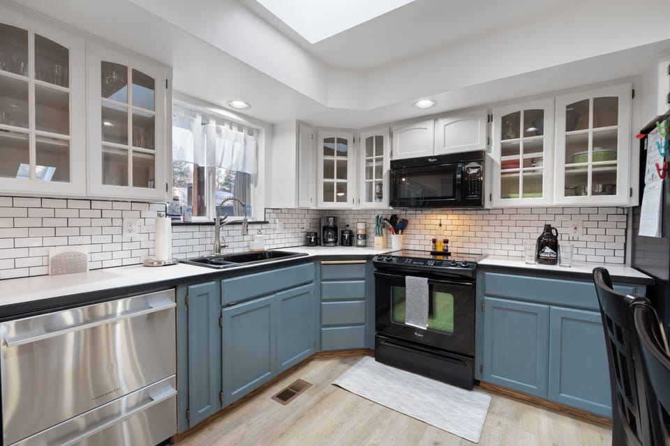 Corner coffee maker, tea, spices, utensils, storage bags, and kids' dining set.