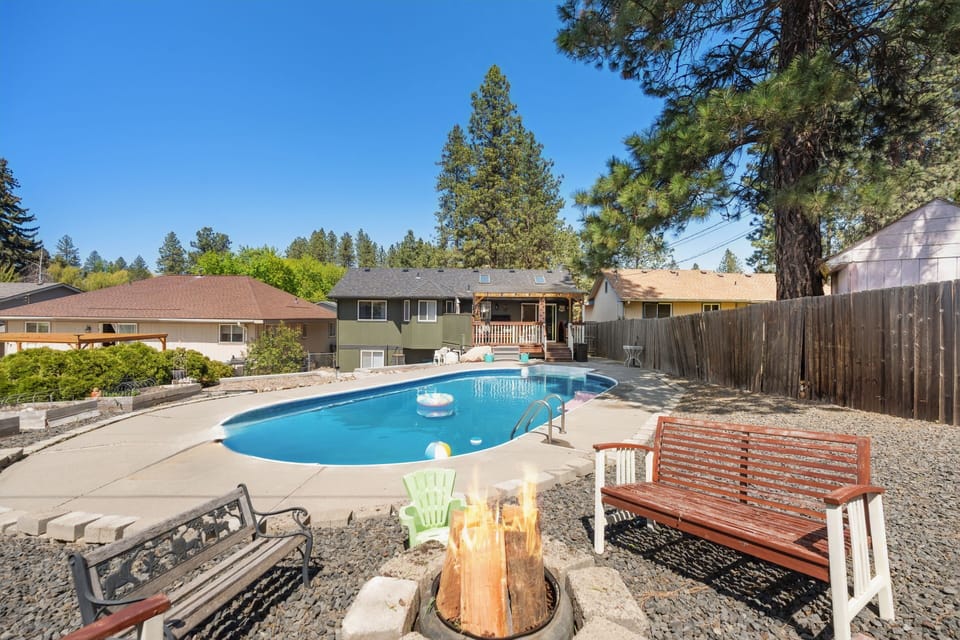 The backyard summer firepit is ideal for cozy nights by the pool.