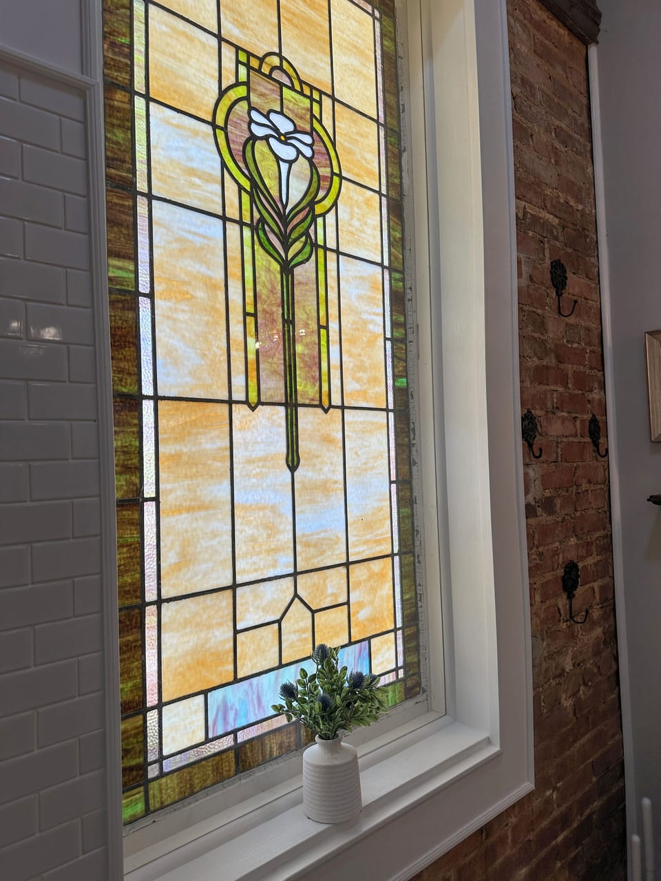 Historic stained glass window in main bathroom