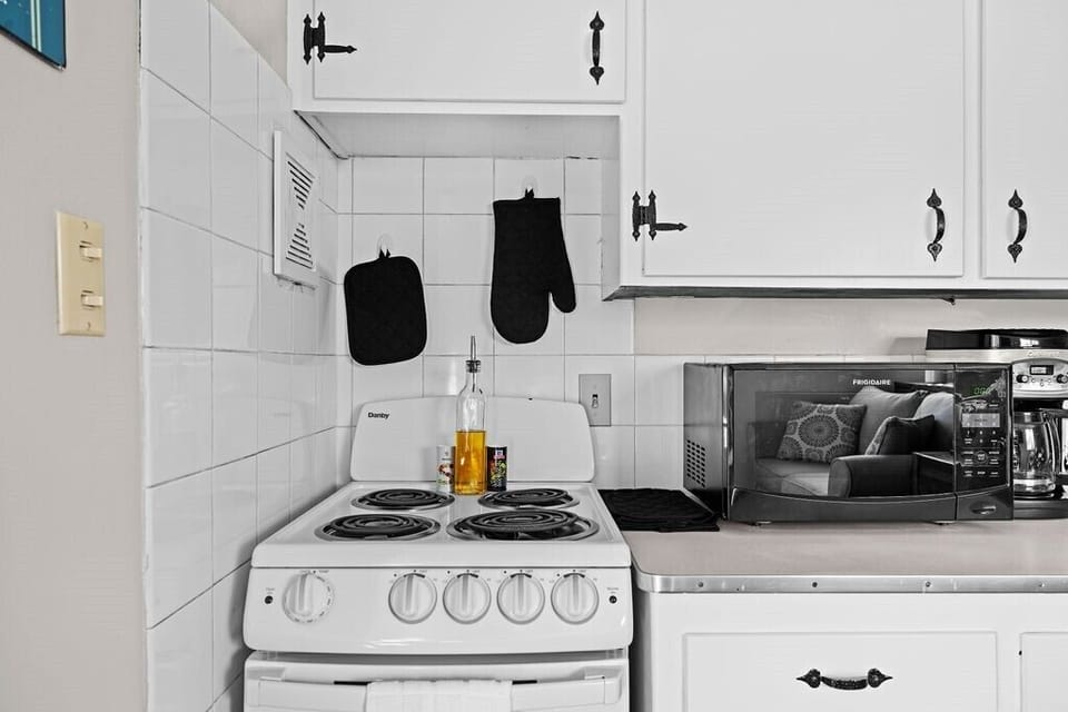 Kitchen includes cookware, bakeware, utensils, spices, and avocado oil.