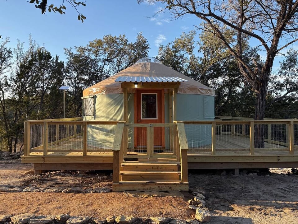 Our treehouse yurt is nestled among beautiful live oaks