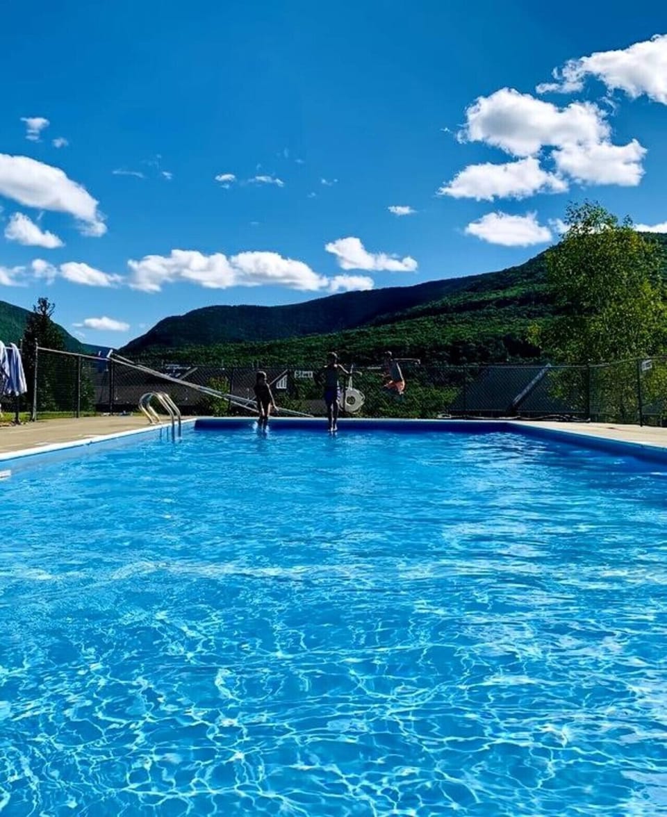 Exclusive Access to the Pool Across the Street with Mountain Views Open from Memorial Day to Labor Day.