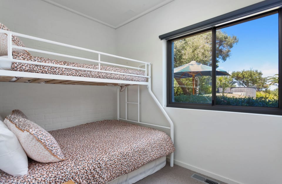 Bunk Room - Double & Single Beds overlooking the manicured garden & deck